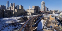 Cycling across the Stone Arch Bridge in Minneapolis, which together with twin city Saint Paul will host the 2016 Winter Cycling Congress. Photo by Maverick Drone Systems.